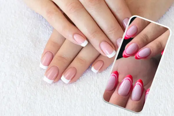 Dłonie z klasycznym french manicure i podwójnym frenchem w kolorze różowym i czerwonym.